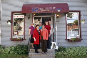 Elly Sienkiewicz, me and the owners and employees at Quilting B & More